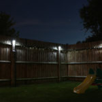Backyard with solar lights at night