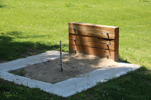 A sand pit for playing horseshoes
