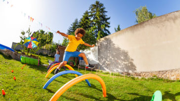 Competitive active game - boy jump over obstacles