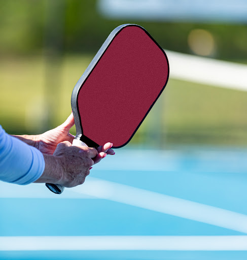 Athlete demonstrates the pickleball ready position for the paddl