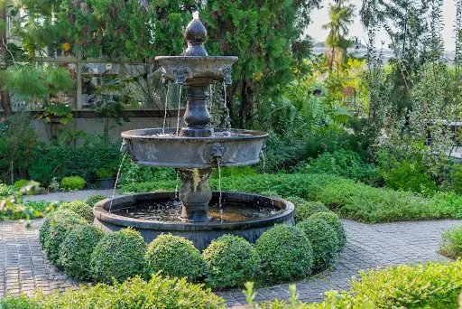Courtyard fountain surrounded by greenery