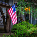 An American flag hangs in a neighborhood of the King William Historic District in San Antonio, Texas.