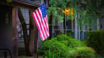 An American flag hangs in a neighborhood of the King William Historic District in San Antonio, Texas.
