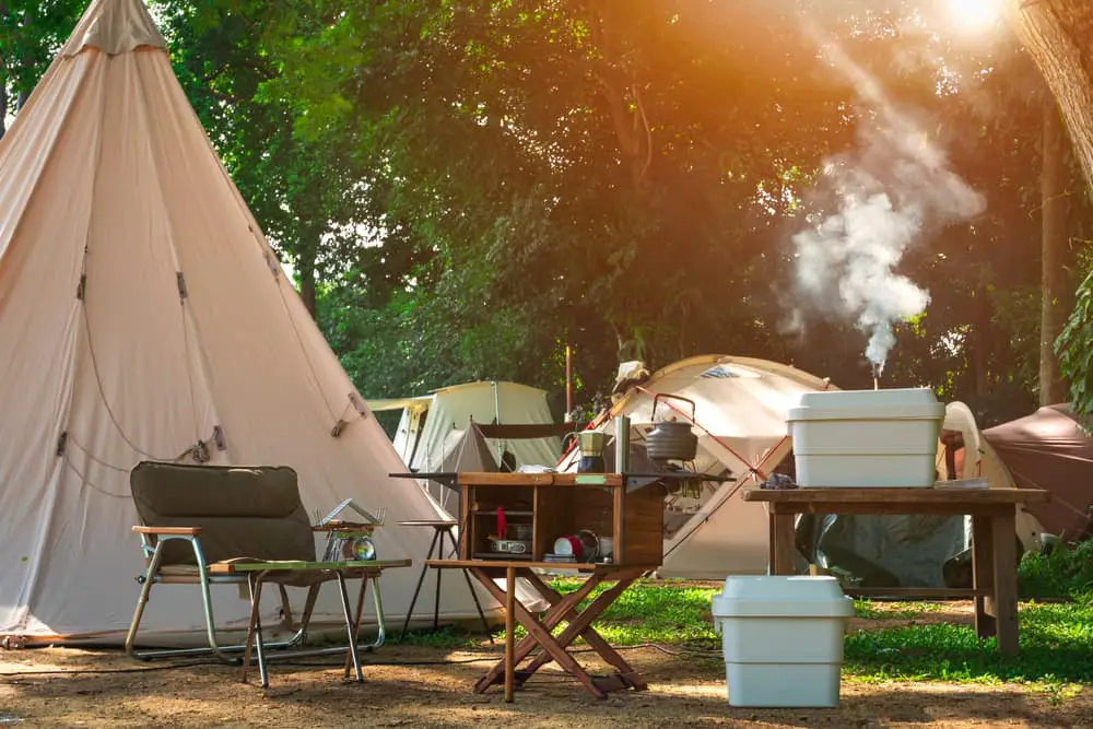 Campsite with tents, chairs. fire