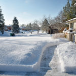 Heavy-snowfall-cleared-from-residential-driveway-and-walkway