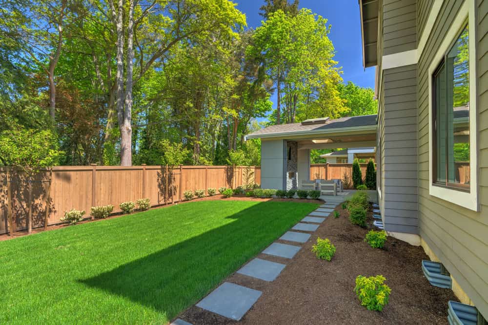 Landscaping-with-wooden-backyard-fence.